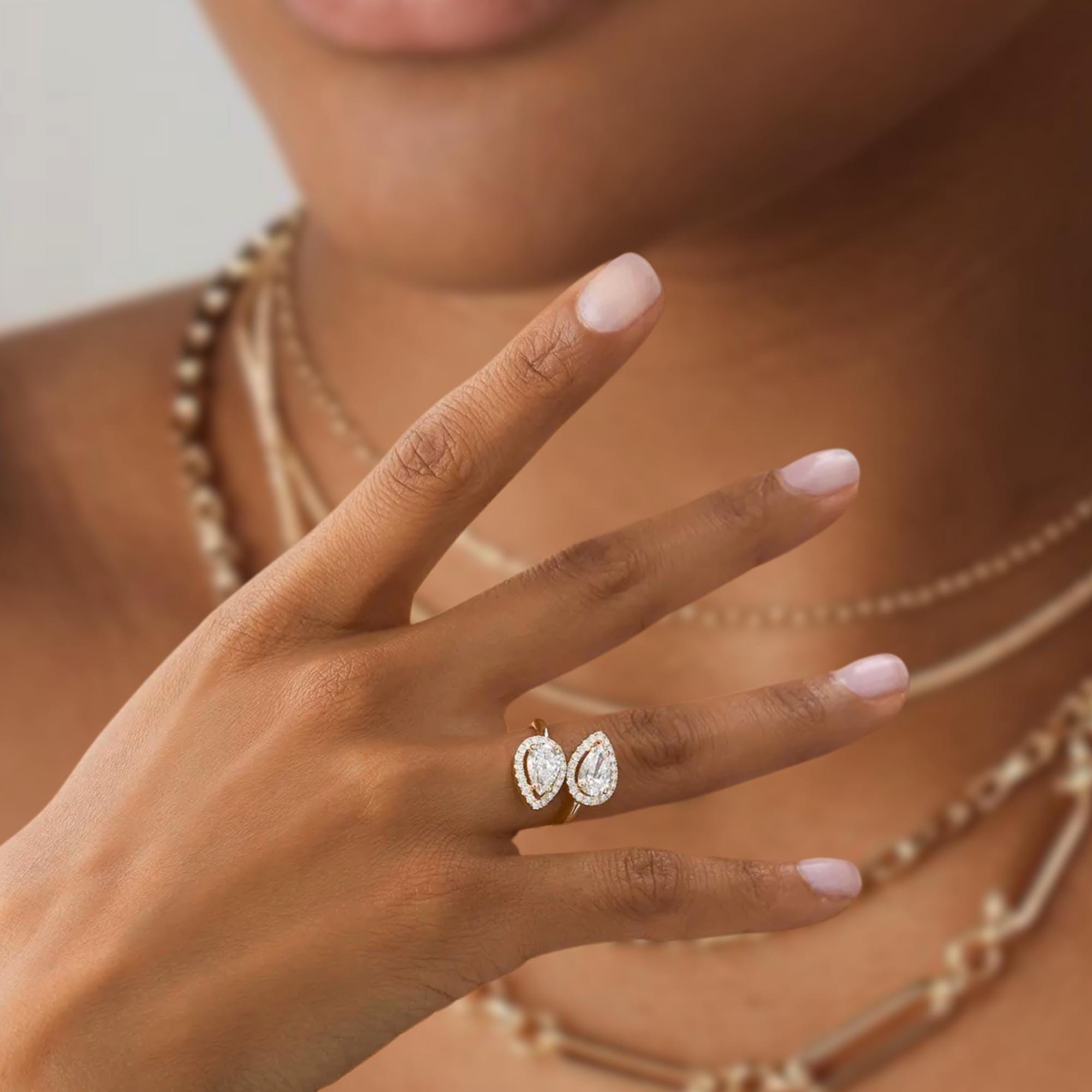14k Cross Over Pear Shaped Halo Diamond Ring