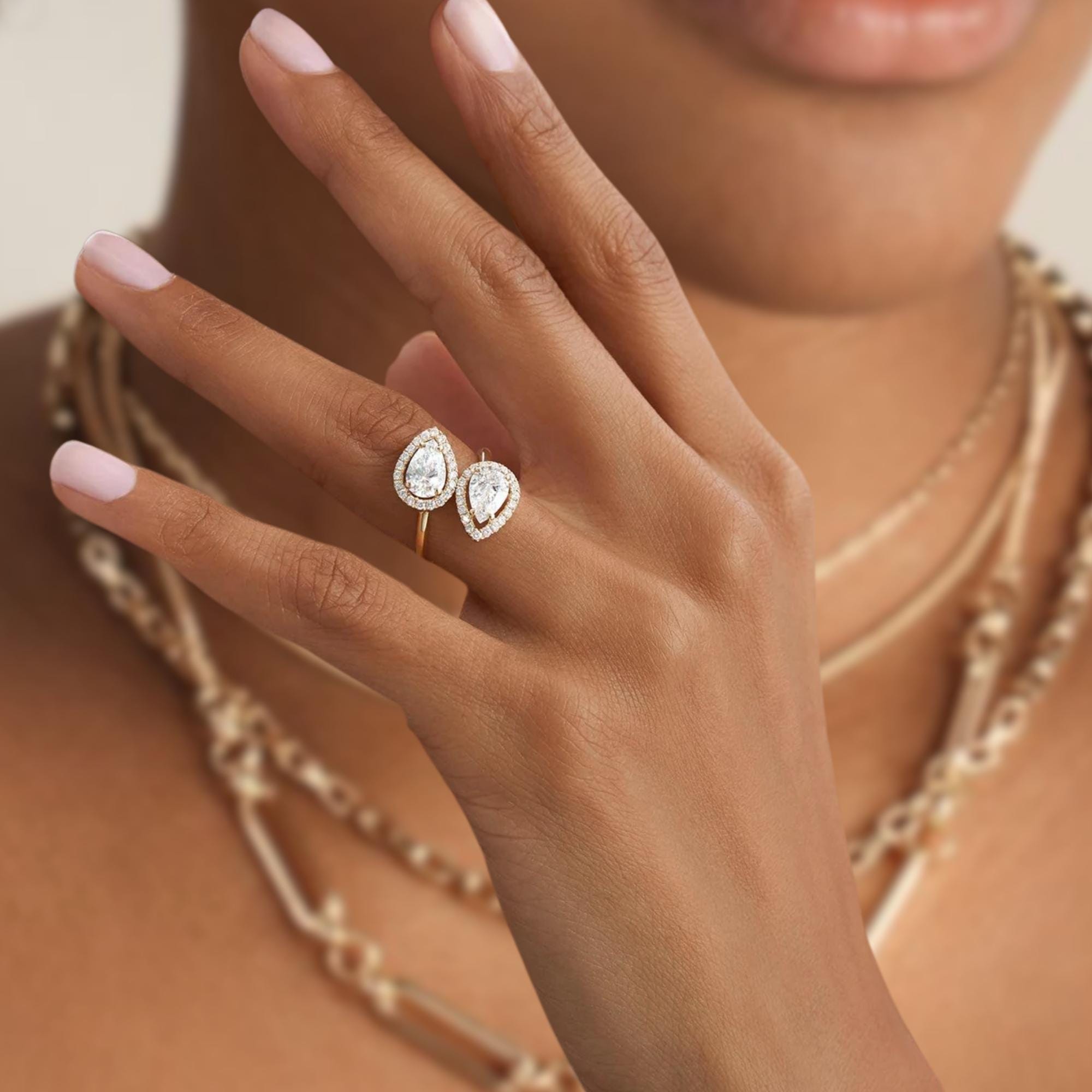 14k Cross Over Pear Shaped Halo Diamond Ring
