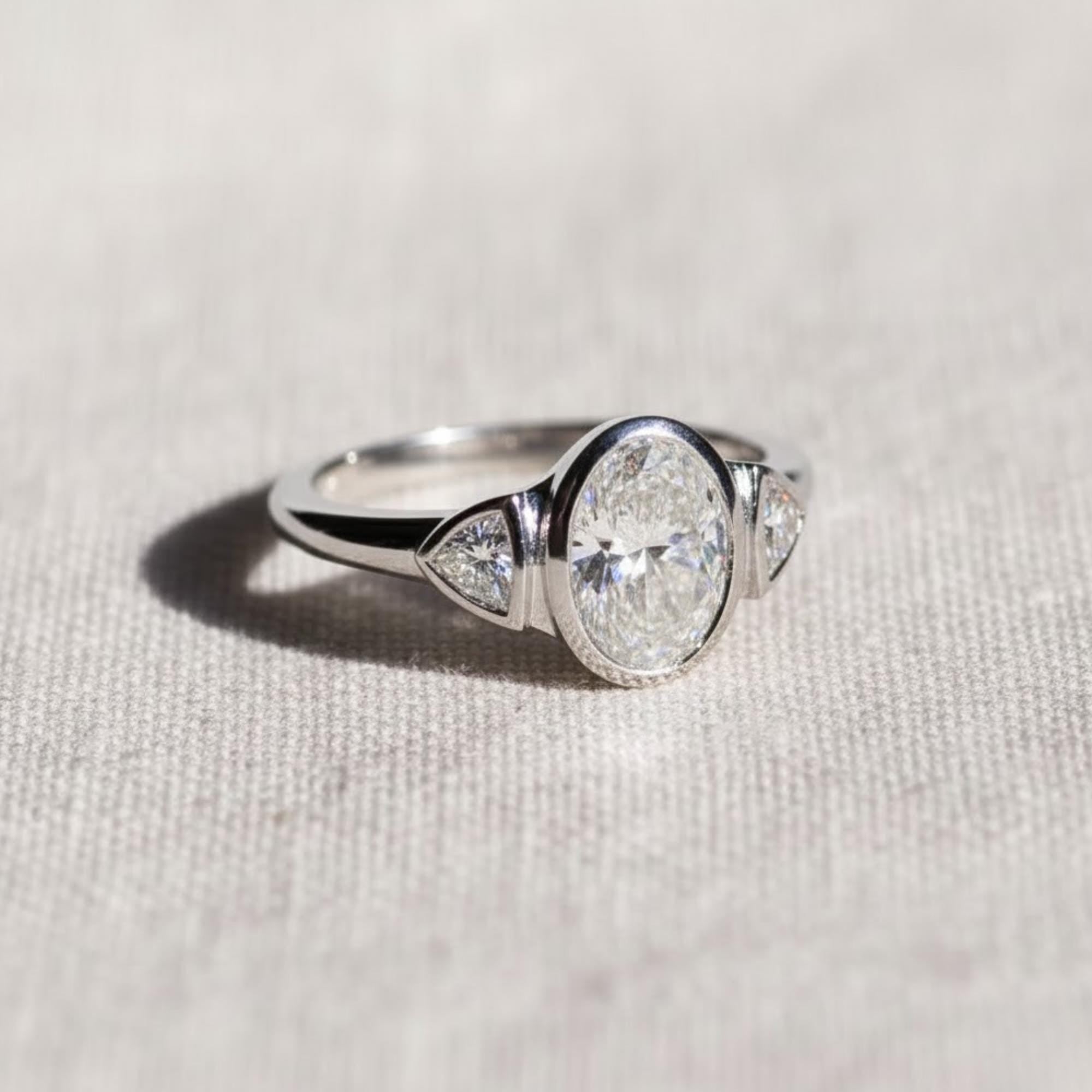 Oval Three Stone Bezel Set Lab Diamond Ring