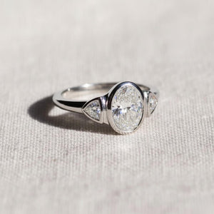 Oval Three Stone Bezel Set Lab Diamond Ring
