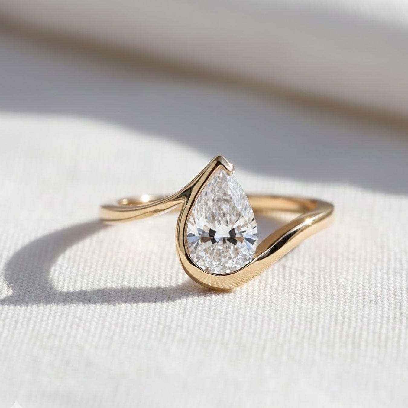 1.5 Ct Pear Cut Diamond Half Bezel Engagement Ring