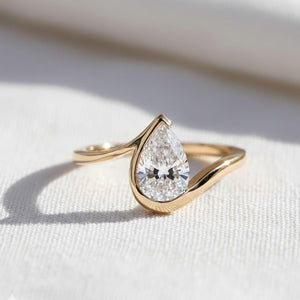 1.5 Ct Pear Cut Diamond Half Bezel Engagement Ring