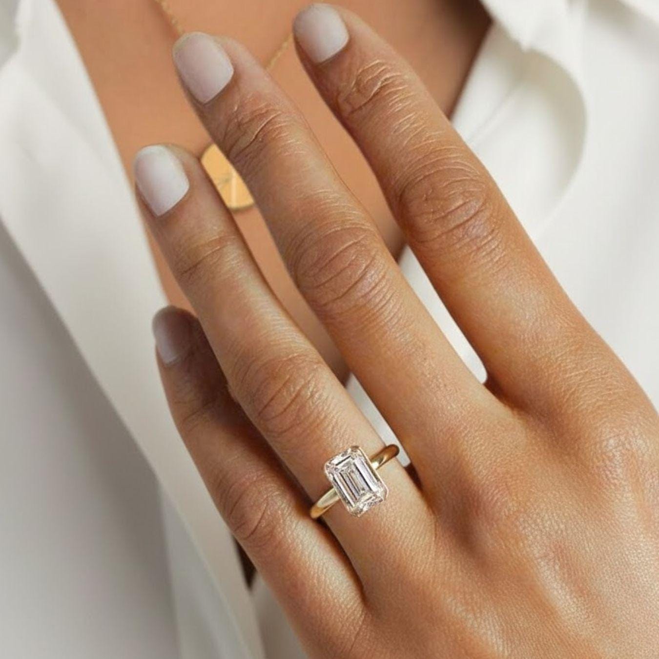 Emerald Cut Diamond Solitaire Ring in 14k Yellow Gold