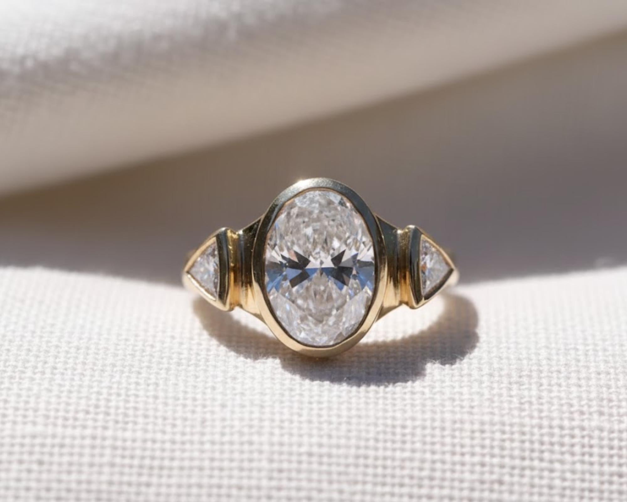 Oval Three Stone Bezel Set Lab Diamond Ring