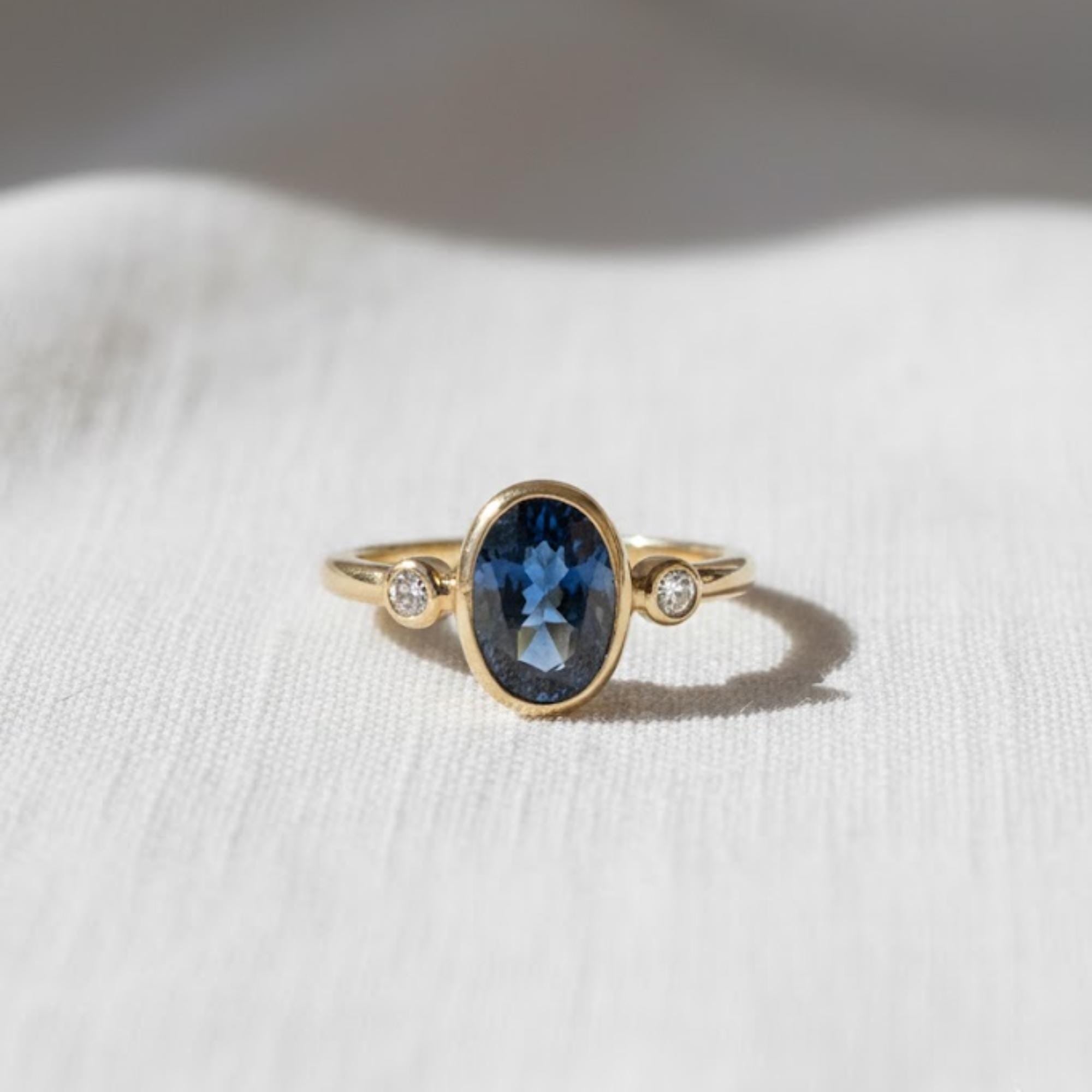 2 Ct Blue Oval Lab Diamond Three Stone Bezel Engagement Ring