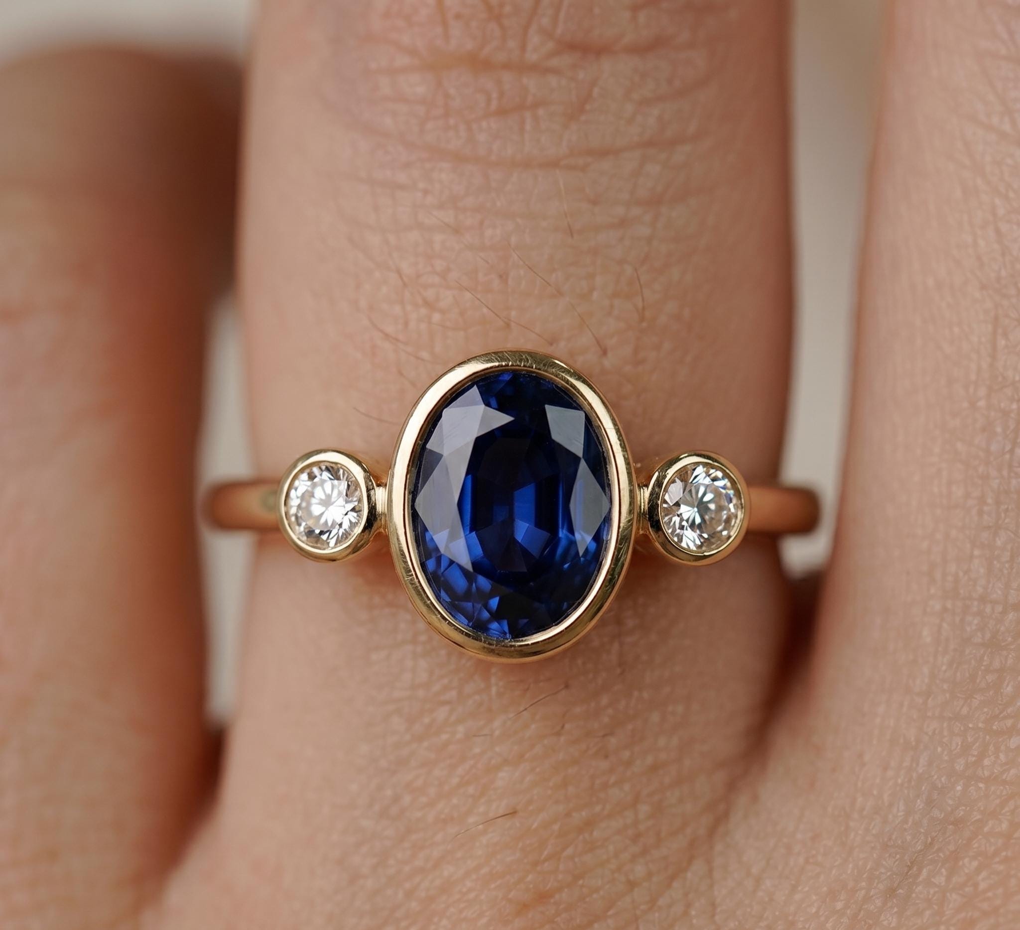 2 Ct Blue Oval Lab Diamond Three Stone Bezel Engagement Ring