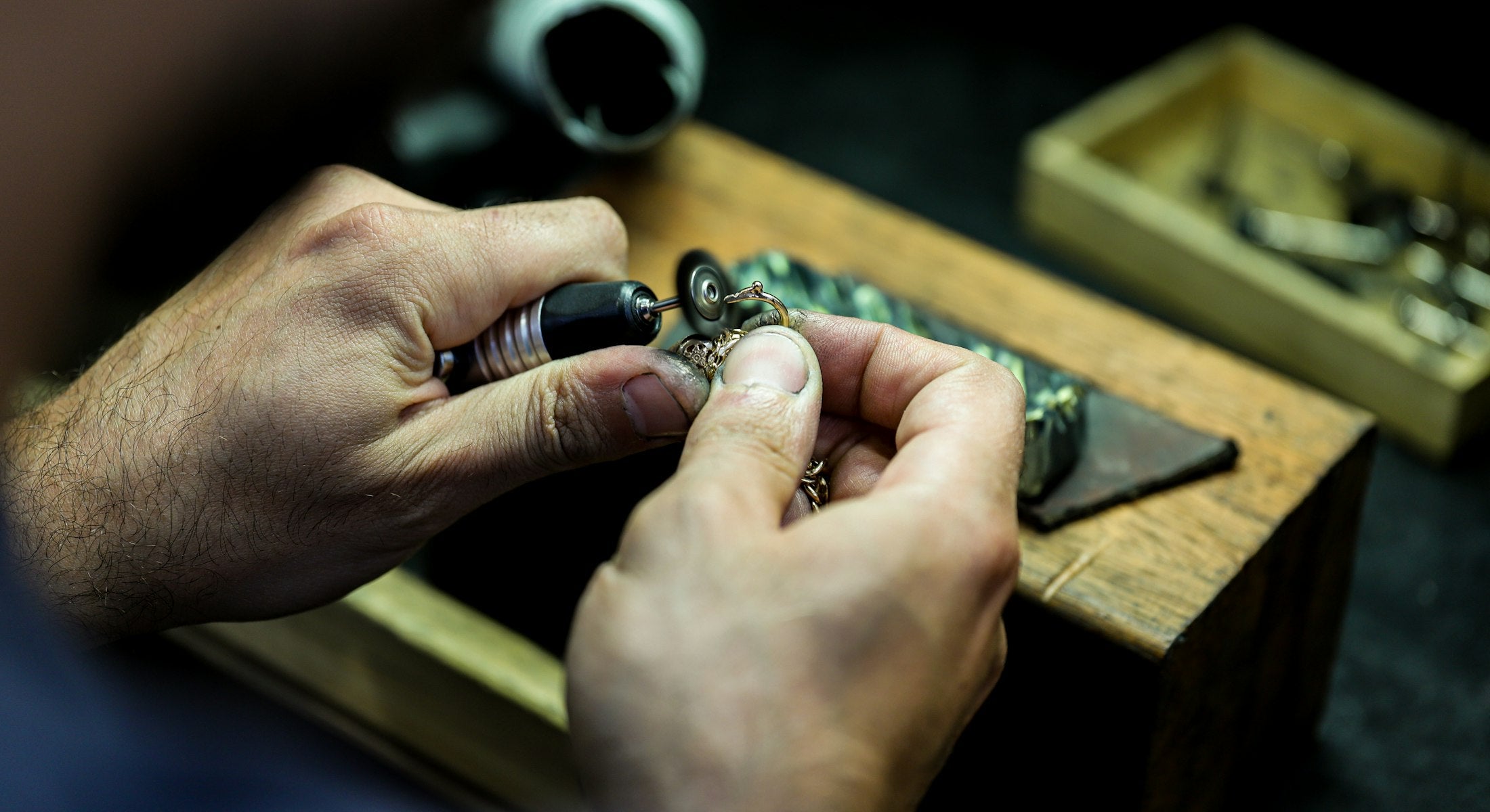 EMORA craftsperson finishing a piece of jewellery by hand